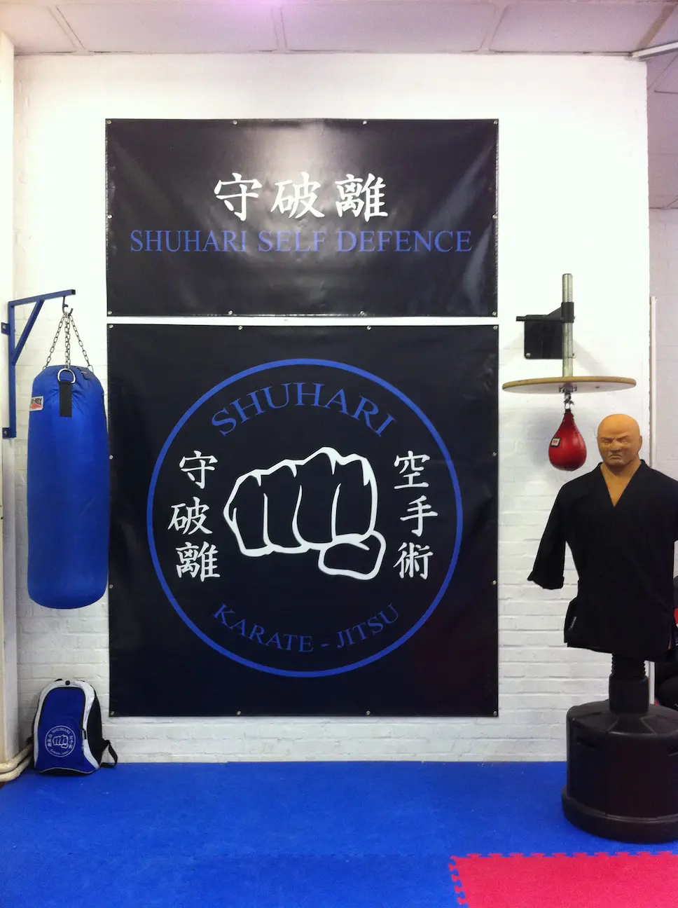 Martial arts class in action at Shuhari Self Defence Bracknell location with students practicing different techniques 