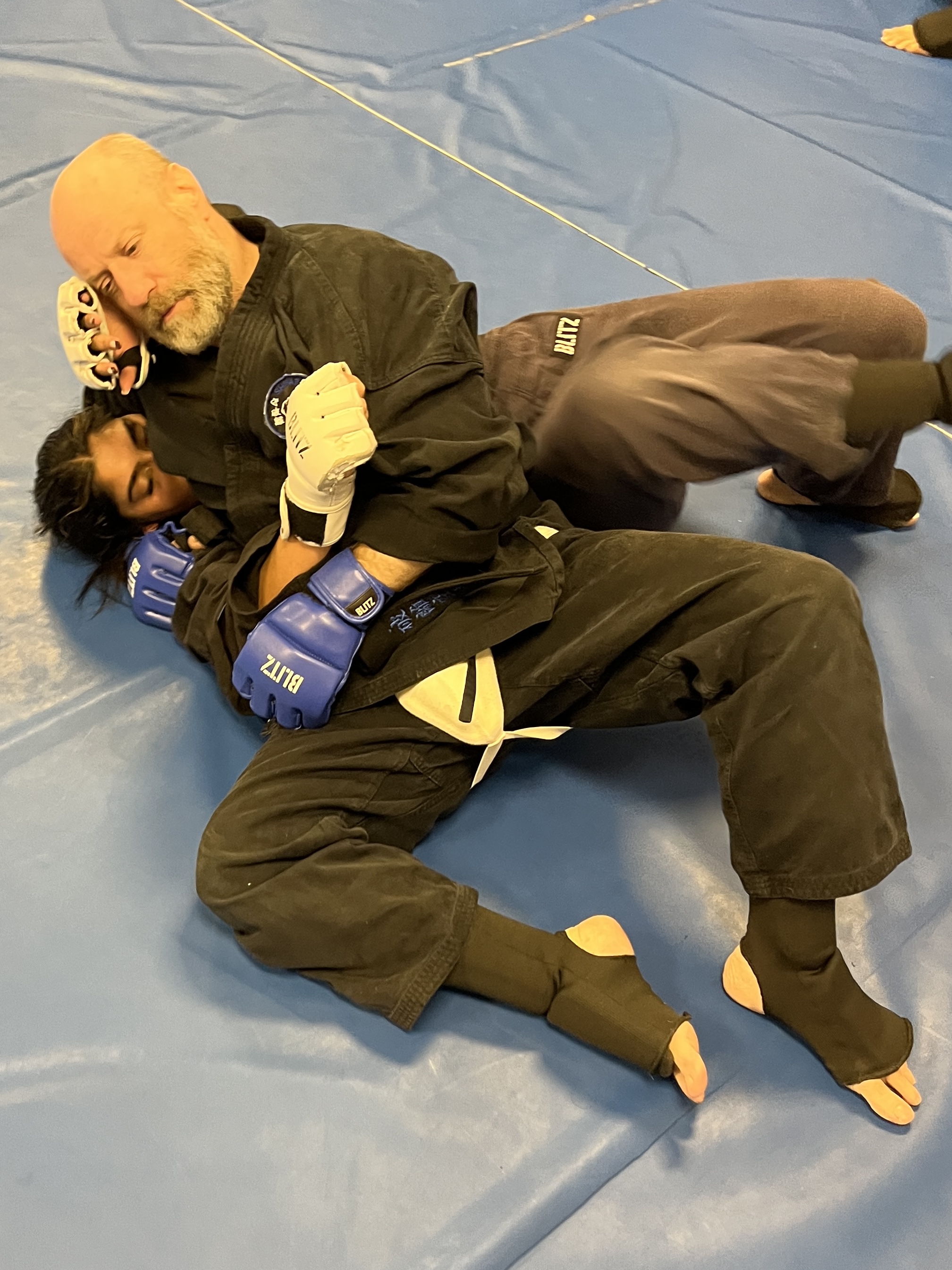 Brian Southon of Shuhari Self Defence Cippenham practicing ground grappling in an MMA session