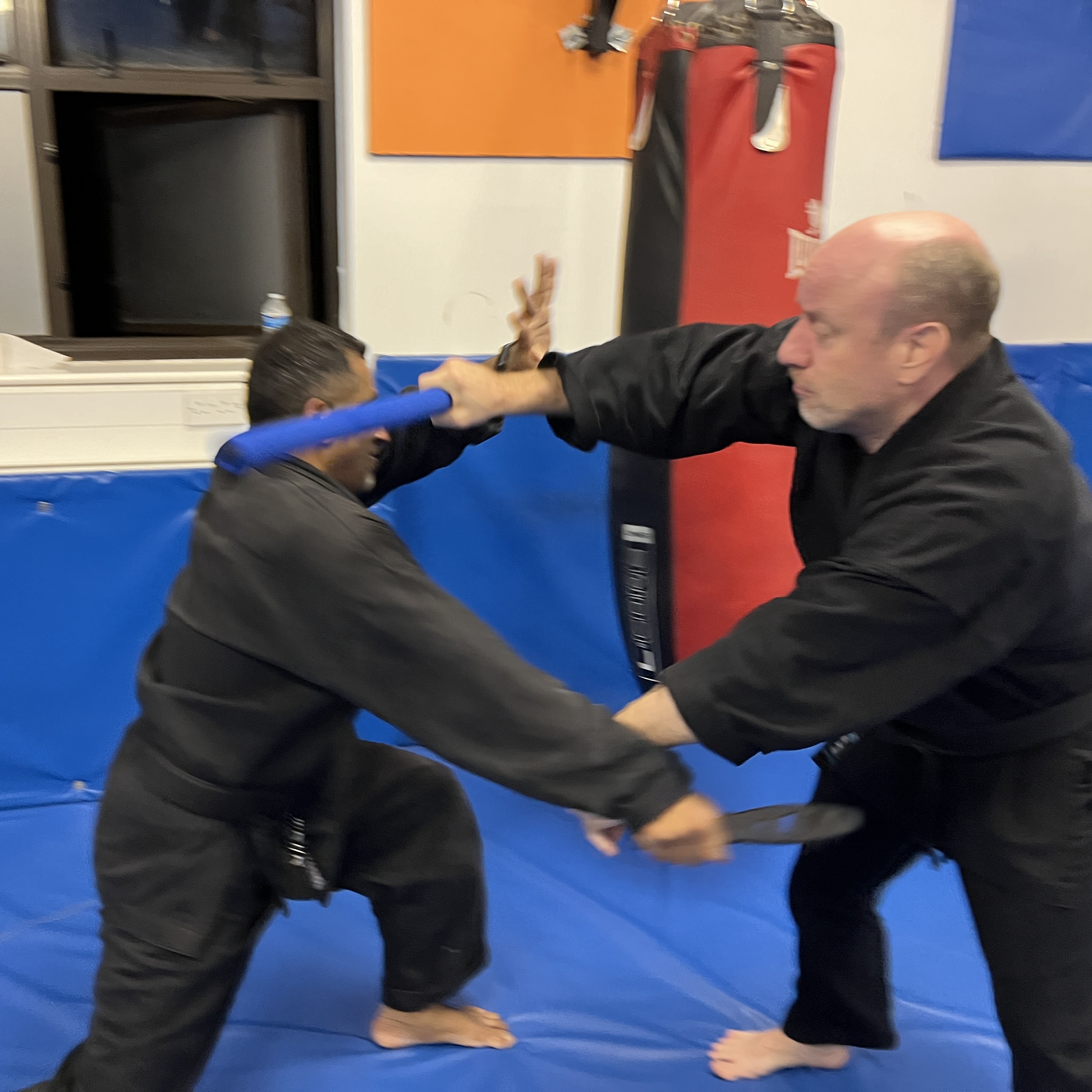 Brian Southon of Shuhari Self Defence Cippenham practicing stick vs knife in a self defence class