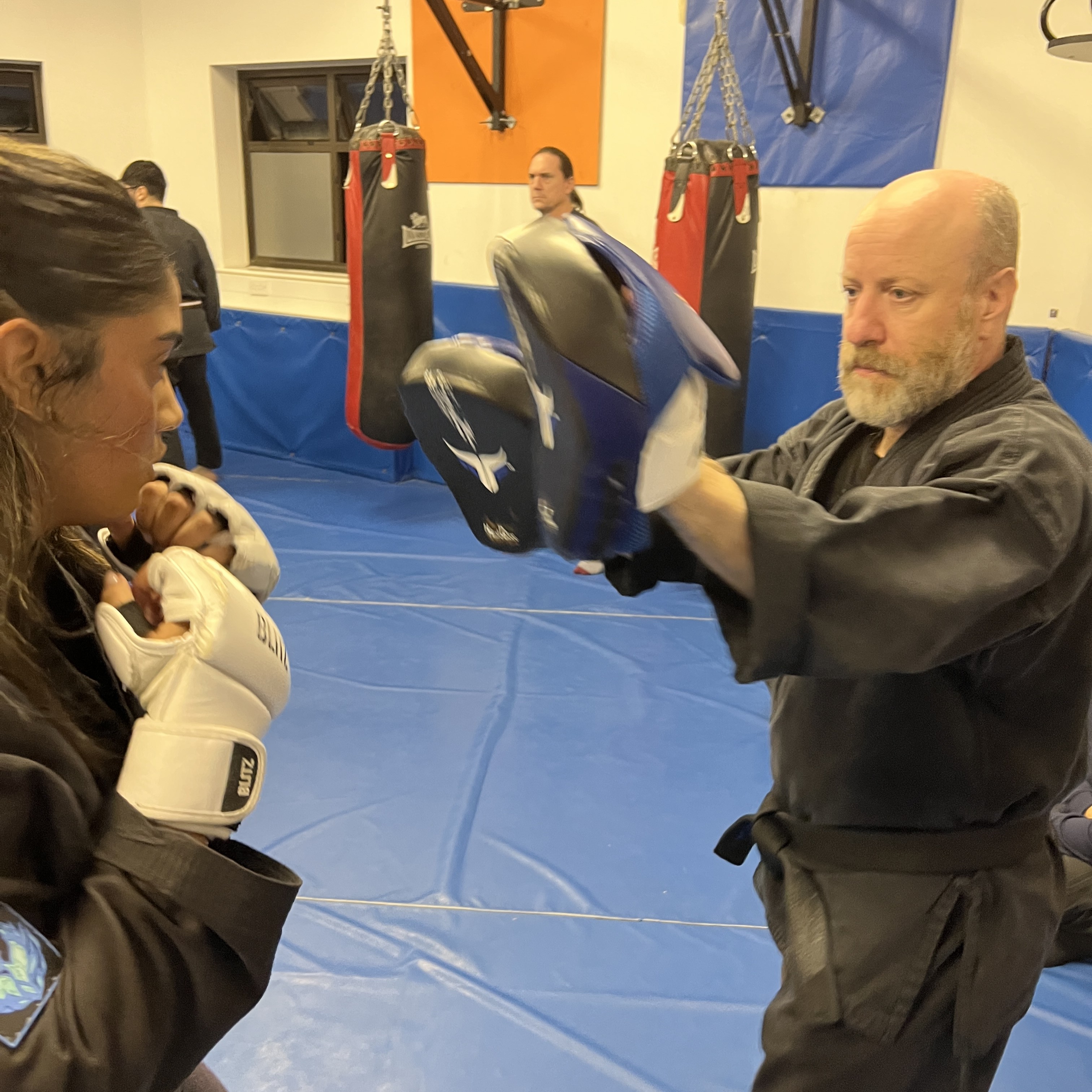 Brian Southon of Shuhari Self Defence Cippenham teaching pad work in karate class for adults