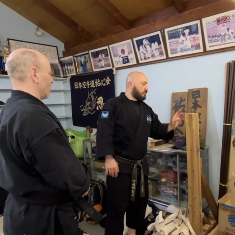 Brian Southon of Shuhari Self Defence Cippenham practicing makiwara with his instructor Olgun Tiltay