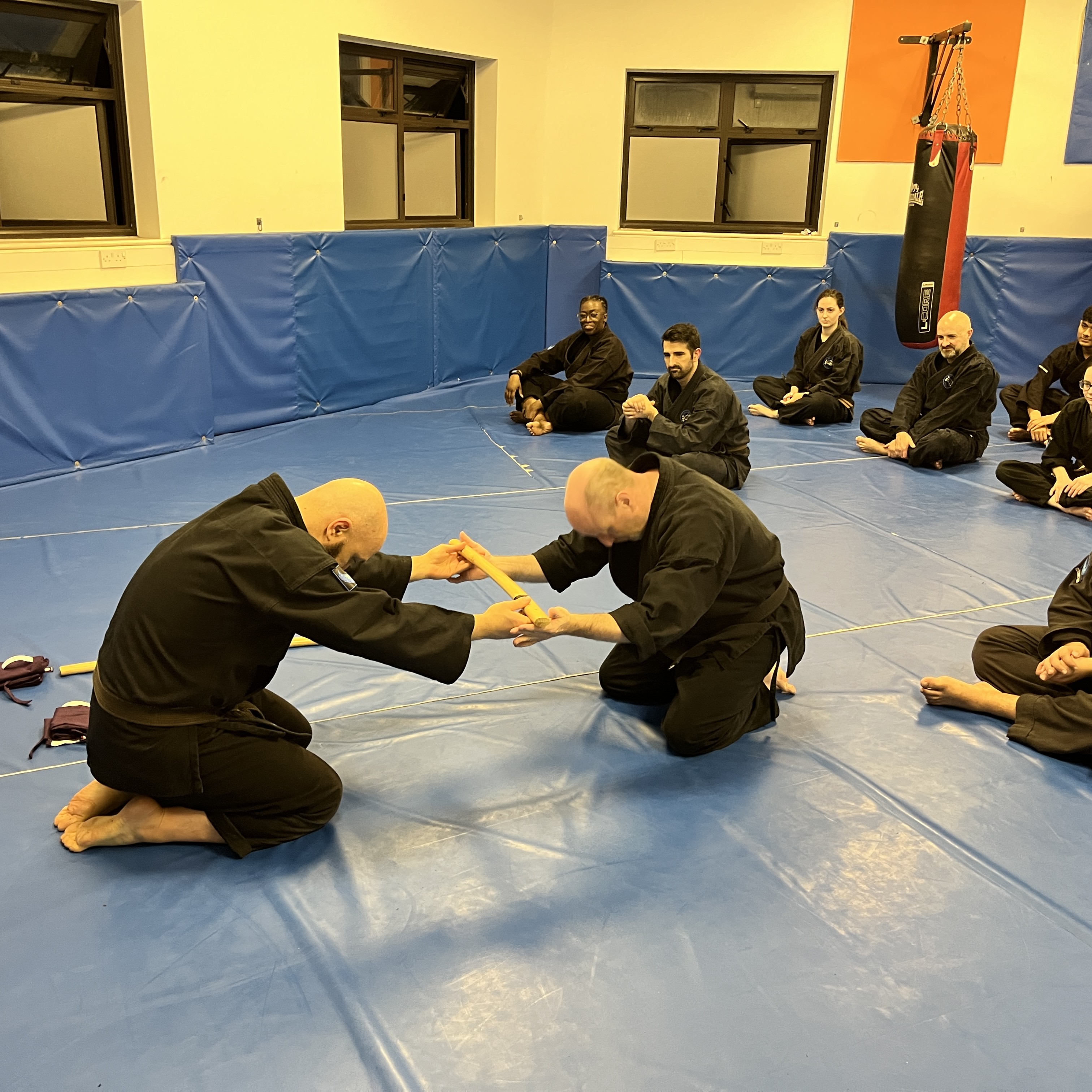 Brian Southon of Shuhari Self Defence Cippenham receiving a gift in senior class from his instructor Olgun Tiltay