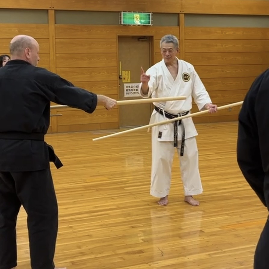 Brian Southon of Shuhari Self Defence Cippenham learning Bo [long staff] in Nagoya Japan from Hideki Yamada Sensei