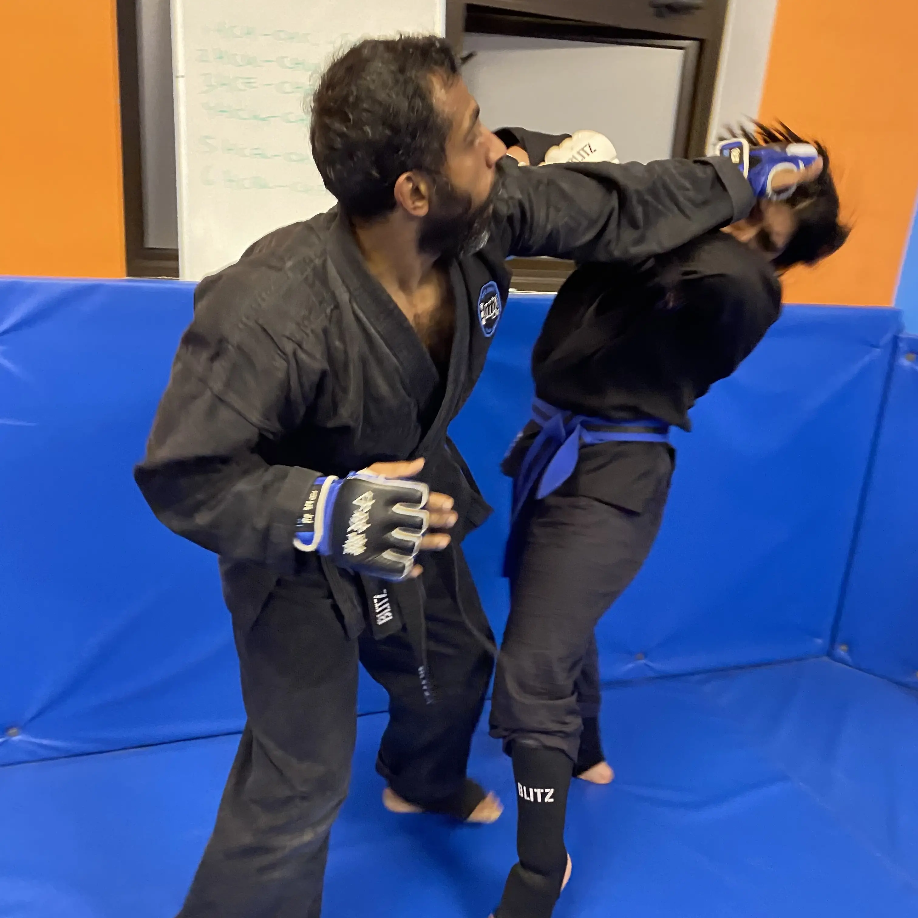 John Moses of Shuhari Self Defence Bracknell doing contact sparring in an MMA class