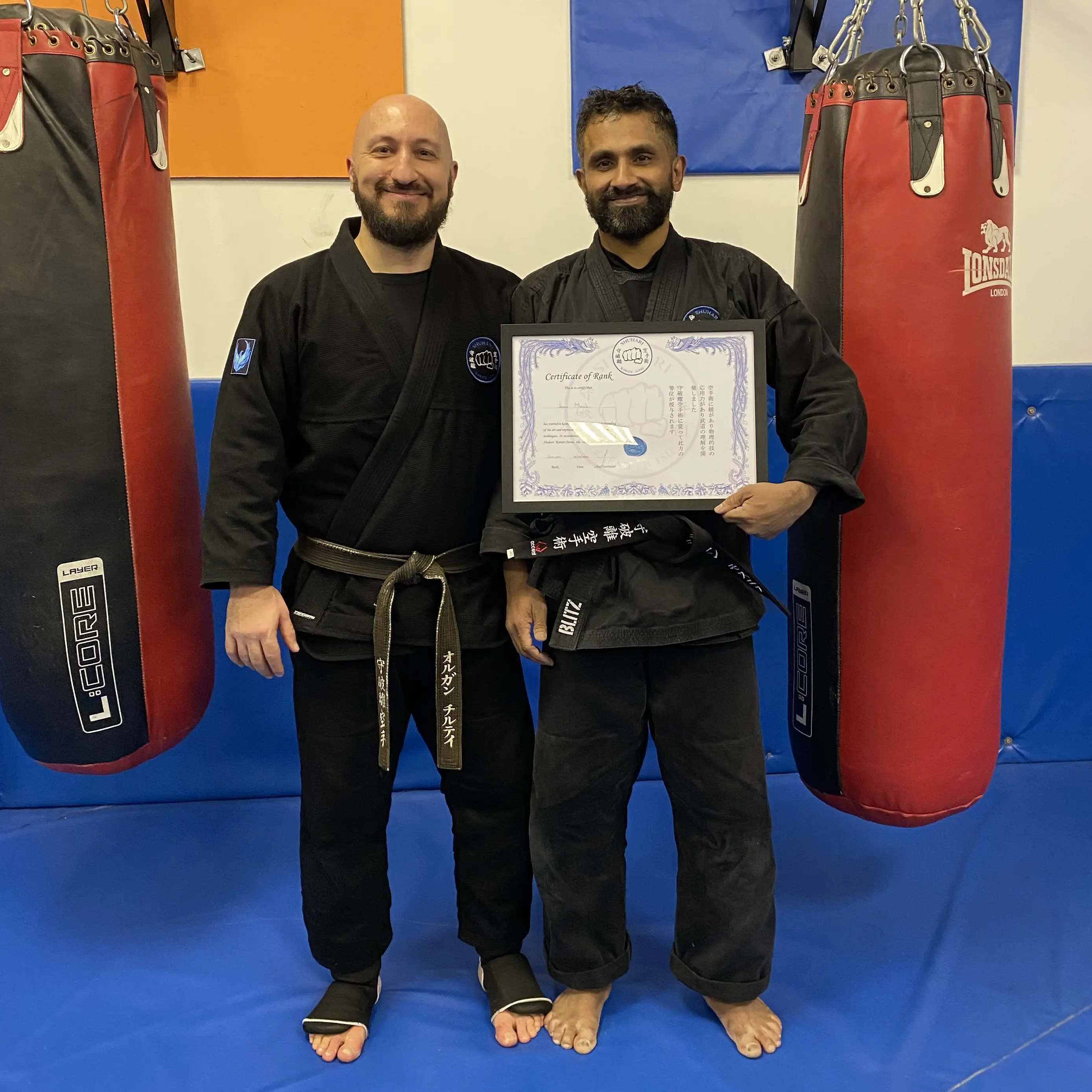 John Moses of Shuhari Self Defence Bracknell graded to his second dan black belt in karate by his instructor Olgun Tiltay John Moses of Shuhari Self Defence Bracknell graded to his second dan black belt in karate by his instructor Olgun Tiltay
