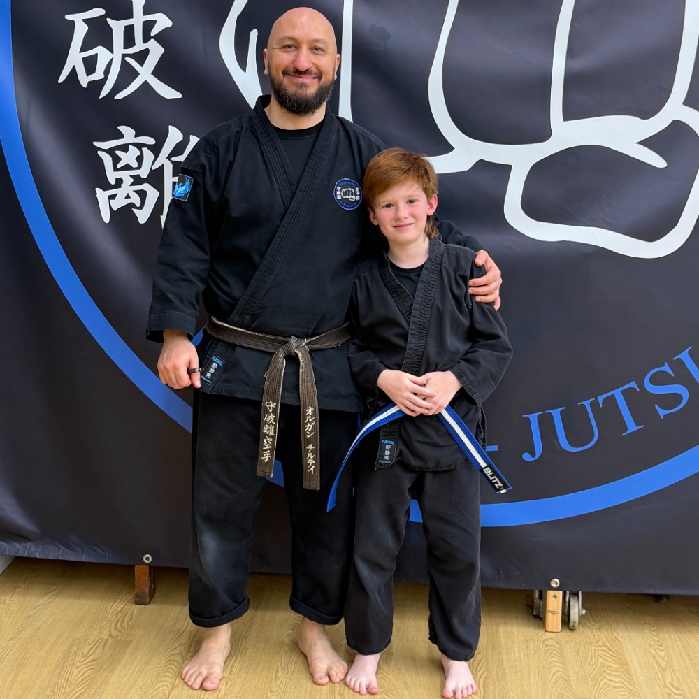 Male martial arts instructor with student at Shuhari Self Defence Bracknell