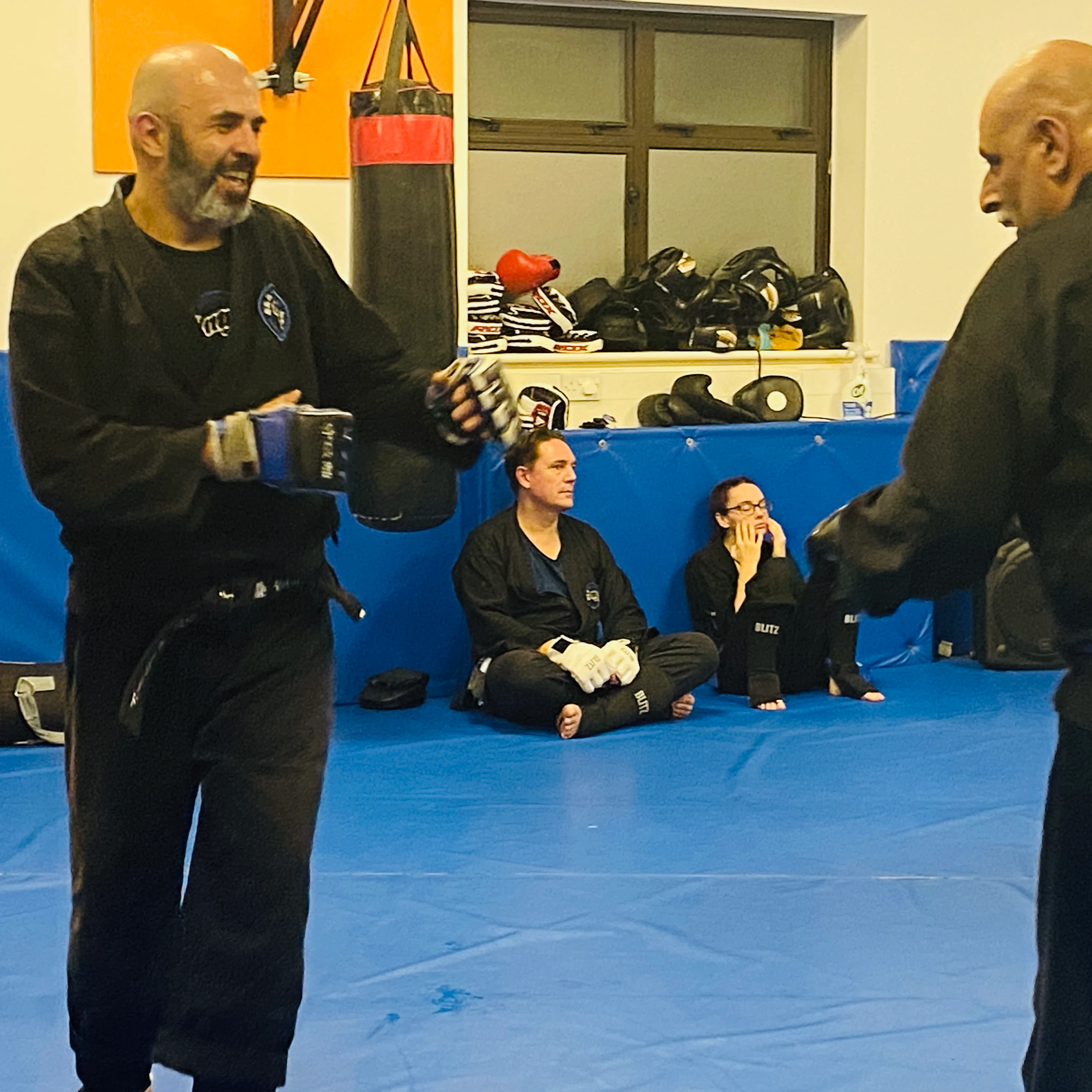 Majid Khalid of Shuhari Self Defence Slough enjoying sparring in an MMA class