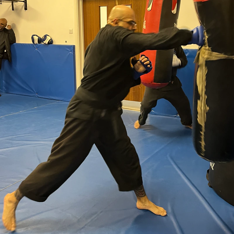 Majid Khalid of Shuhari Self Defence Slough practicing bag work in a martial arts class