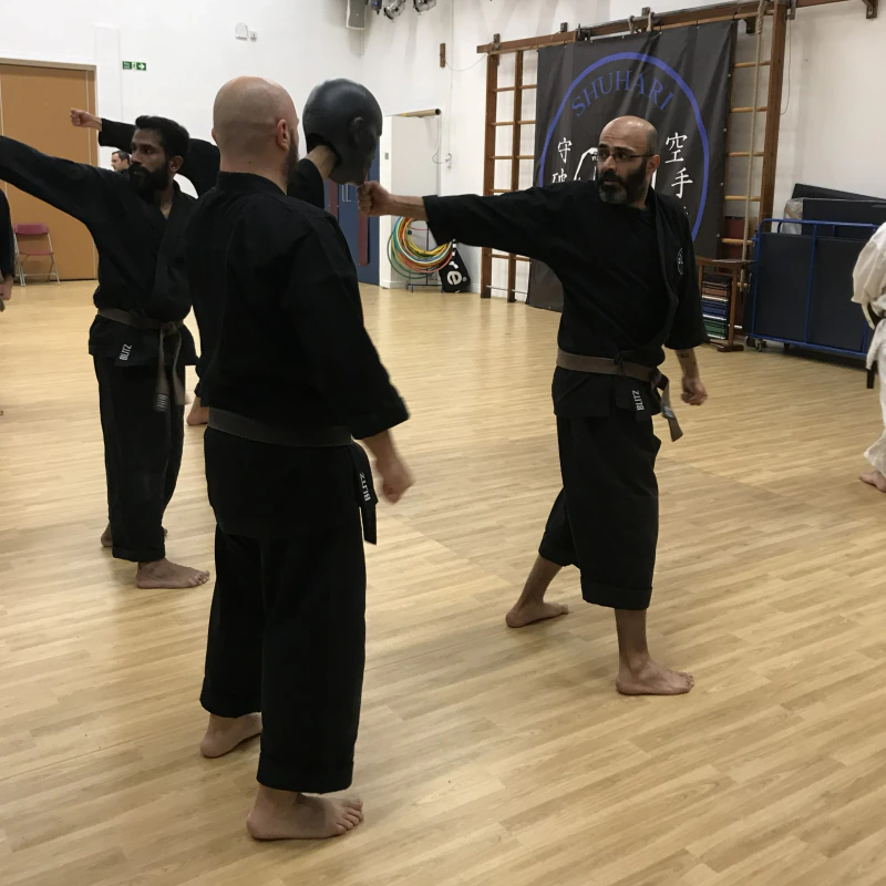Majid Khalid of Shuhari Self Defence Slough practicing impact in a karate class