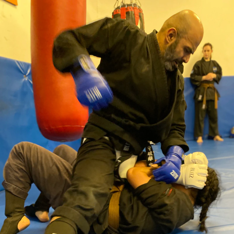 Majid Khalid of Shuhari Self Defence Slough practicing striking from mount in an MMA session