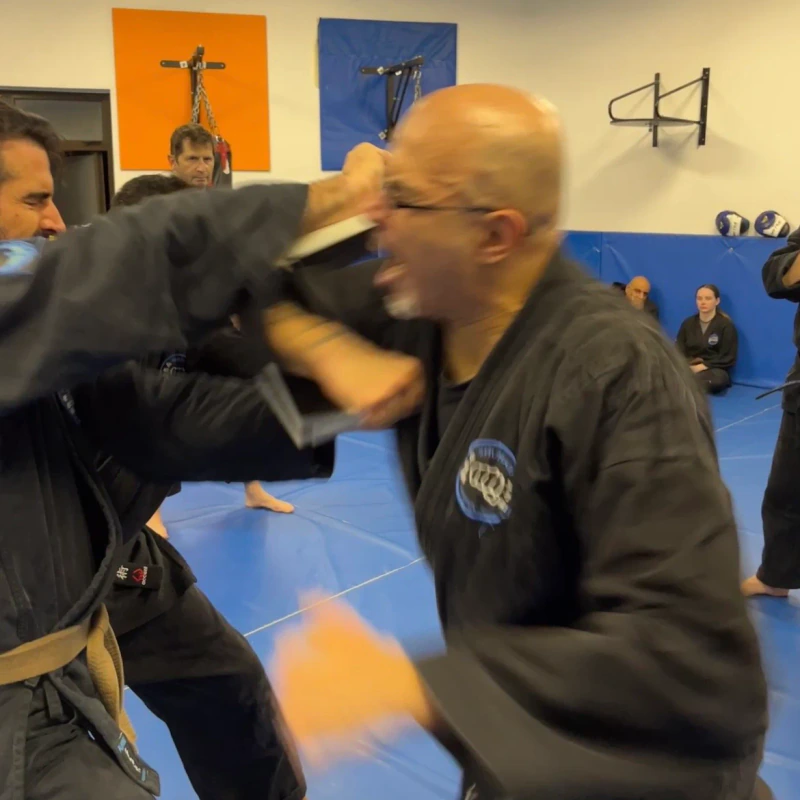 Majid Khalid of Shuhari Self Defence Slough practicing tameshiwari in a karate class